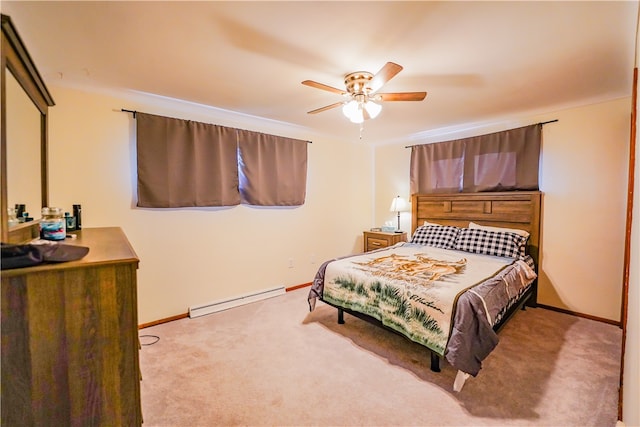 carpeted bedroom with baseboard heating and ceiling fan