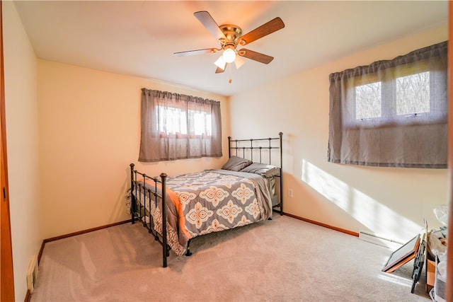 bedroom with ceiling fan and light carpet