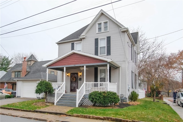 view of property with a front lawn and covered porch