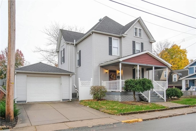 front of property featuring an outdoor structure, a porch, and a garage