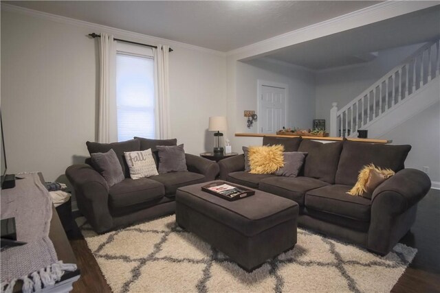 living room with hardwood / wood-style flooring and crown molding