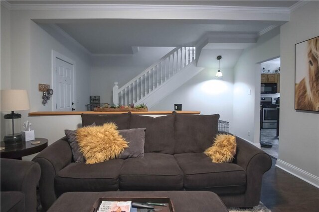 living room with hardwood / wood-style floors and ornamental molding