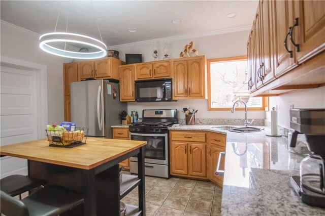 kitchen with appliances with stainless steel finishes, crown molding, sink, butcher block countertops, and light tile patterned flooring