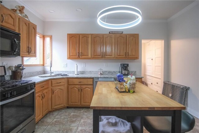 kitchen featuring butcher block countertops, stainless steel gas range oven, crown molding, and light tile patterned floors