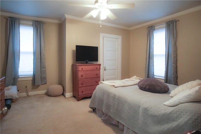 bedroom with ceiling fan, crown molding, and light carpet