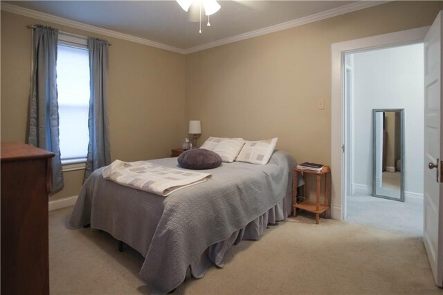 bedroom featuring light colored carpet, ceiling fan, and ornamental molding