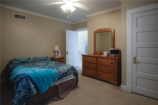 bedroom with ceiling fan, light colored carpet, and ornamental molding