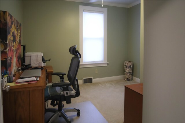 home office with light carpet and ornamental molding