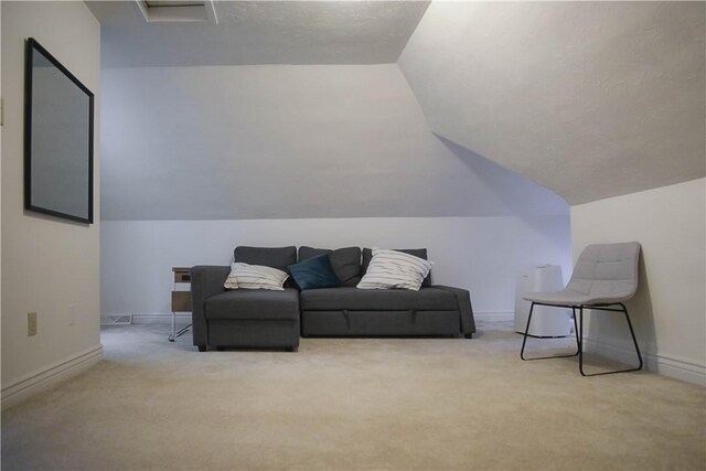 living room with light colored carpet and lofted ceiling