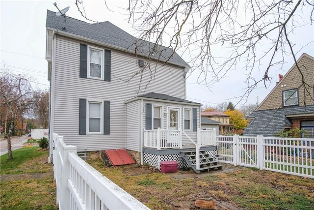 rear view of property with a deck