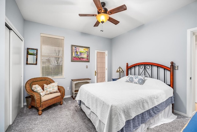 carpeted bedroom featuring ceiling fan and a closet