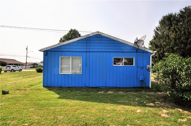 view of property exterior featuring a yard