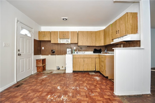 kitchen with dark parquet floors and sink