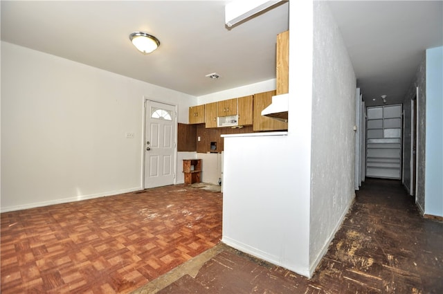 kitchen featuring dark parquet floors