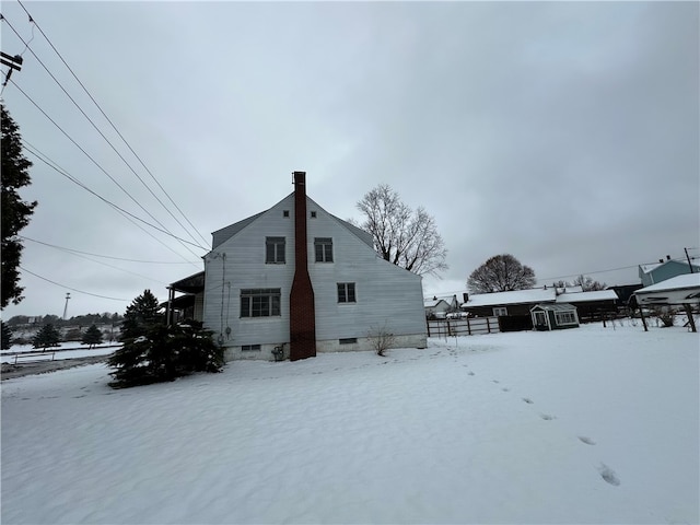 view of snow covered property