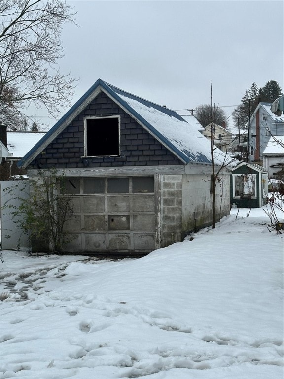 view of snow covered garage