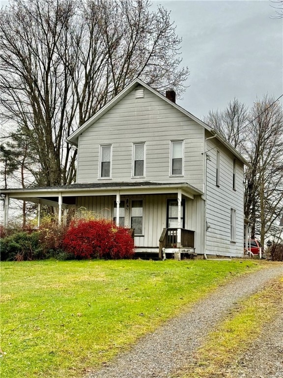 view of front facade with a porch and a front yard