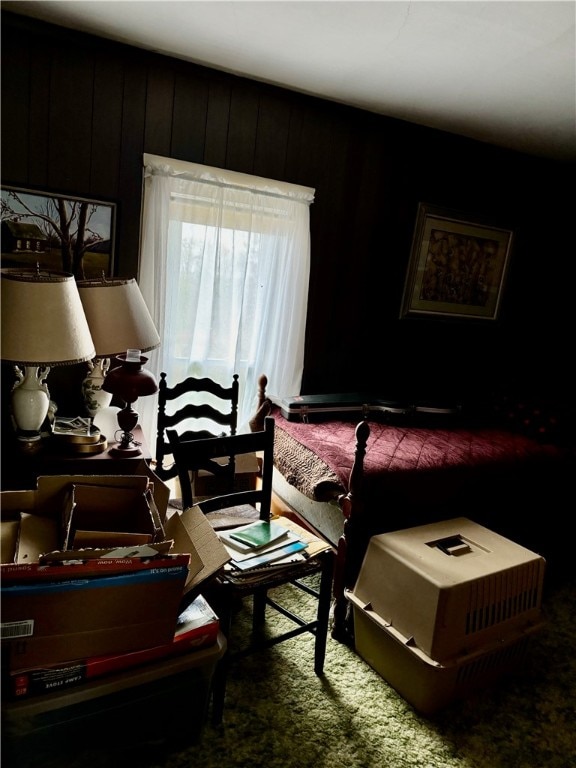 bedroom with wooden walls