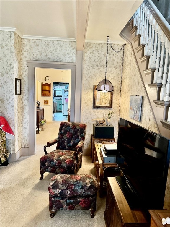 living area with beam ceiling, crown molding, and carpet floors