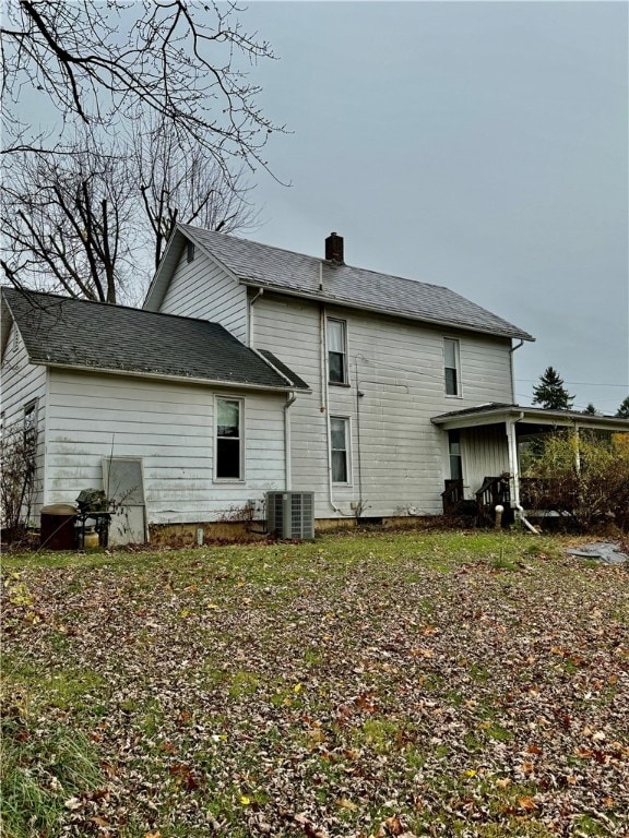 rear view of house with central air condition unit