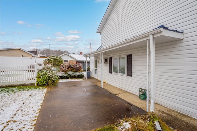 view of side of property with a patio area