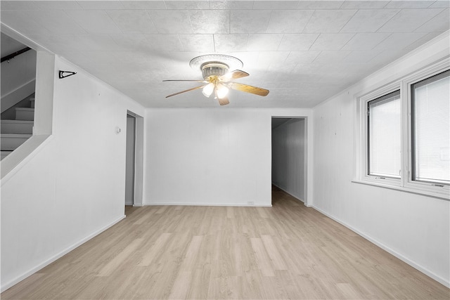 unfurnished room with light hardwood / wood-style floors and ceiling fan