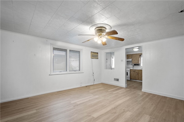 unfurnished room featuring ceiling fan and light hardwood / wood-style floors