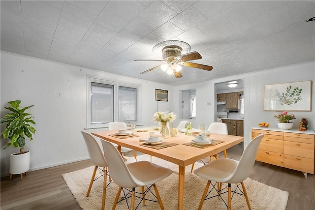 dining room featuring ceiling fan and dark hardwood / wood-style flooring