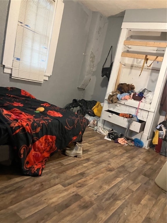 bedroom featuring wood-type flooring