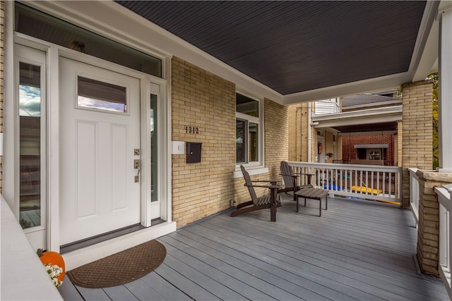 wooden terrace featuring a porch