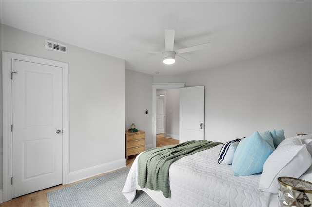 bedroom featuring hardwood / wood-style flooring and ceiling fan