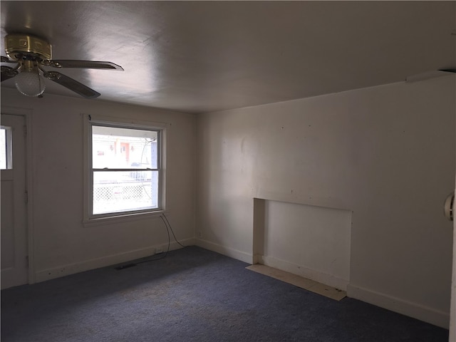 carpeted empty room with ceiling fan