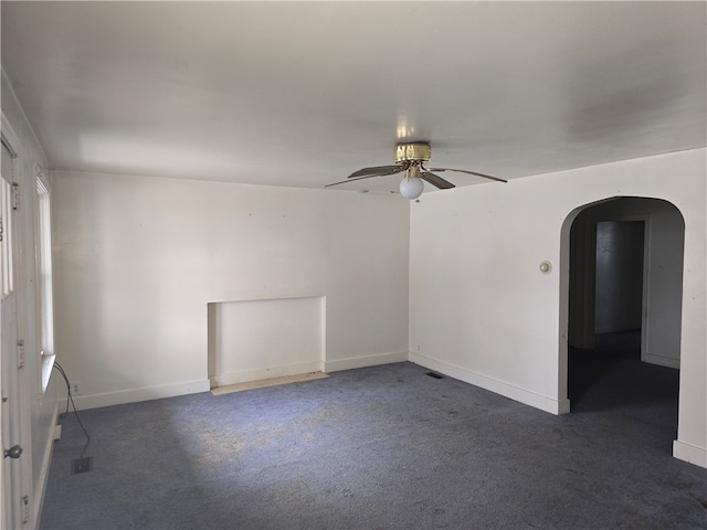 carpeted empty room with ceiling fan