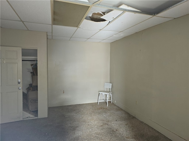 basement featuring a paneled ceiling