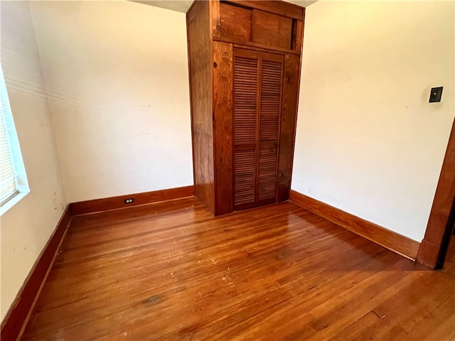 unfurnished bedroom featuring hardwood / wood-style floors