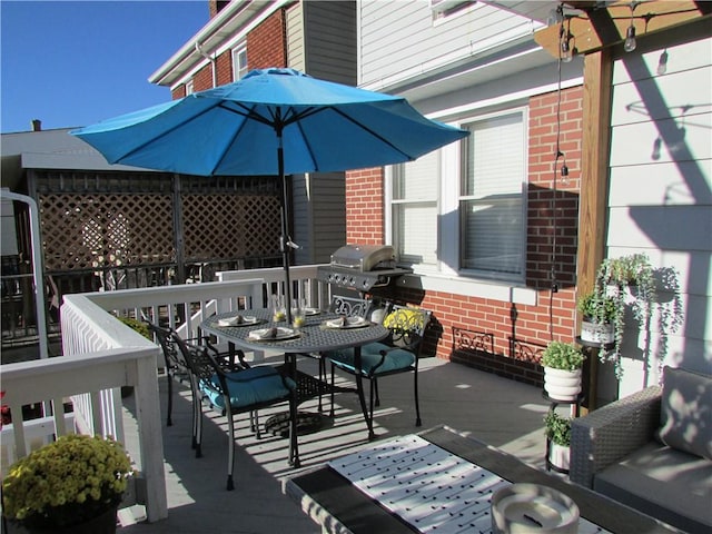 wooden deck with grilling area