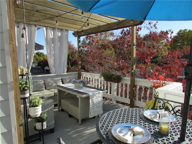 wooden terrace with an outdoor living space and a pergola