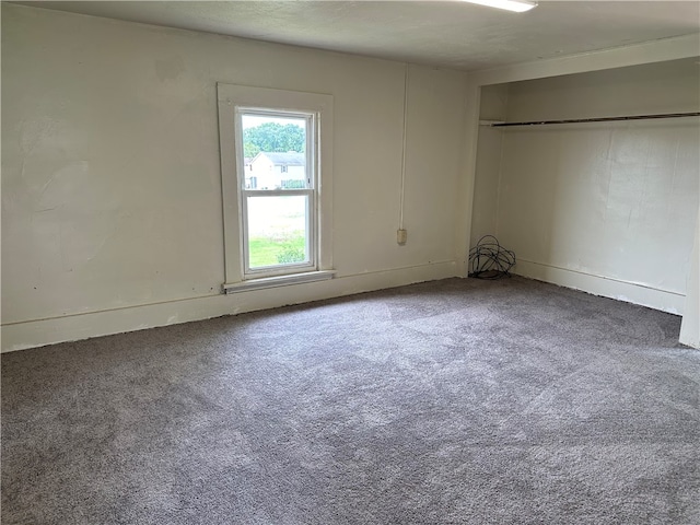 unfurnished room with carpet floors