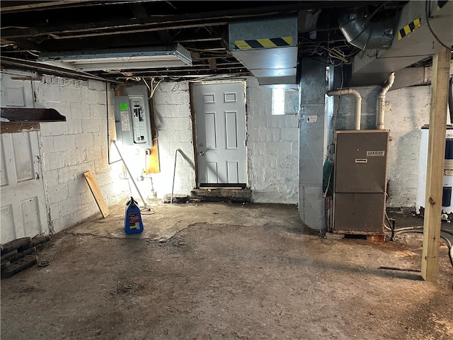 basement featuring water heater and heating unit