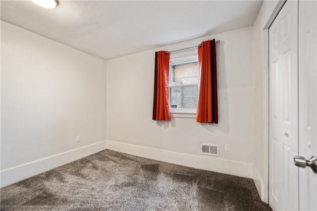 empty room featuring carpet floors