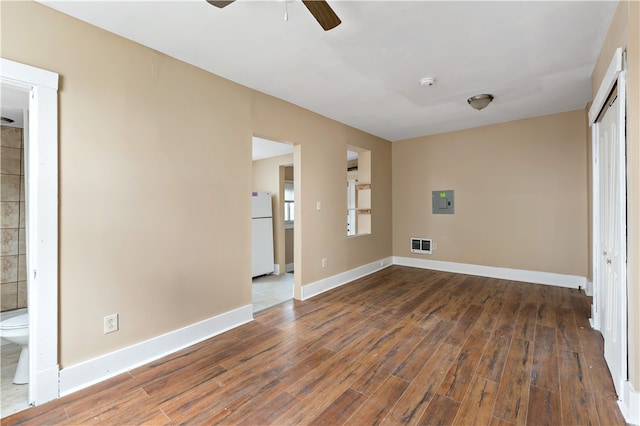 interior space with ceiling fan and dark hardwood / wood-style flooring