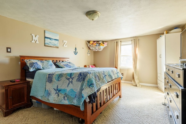 carpeted bedroom with a textured ceiling