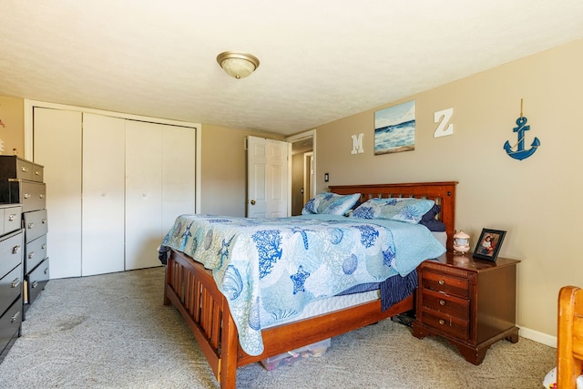 carpeted bedroom featuring a closet