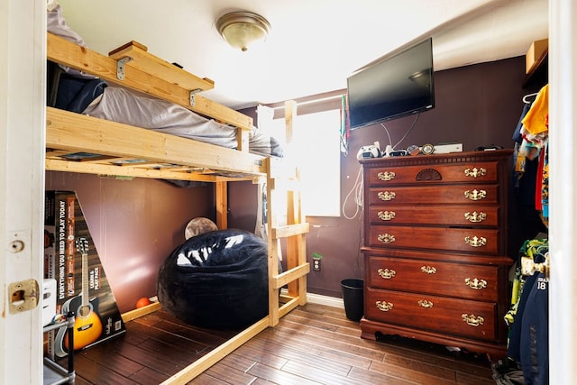 bedroom with hardwood / wood-style floors