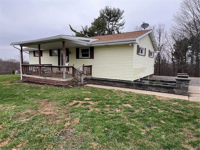 view of front of home with a porch and a front lawn