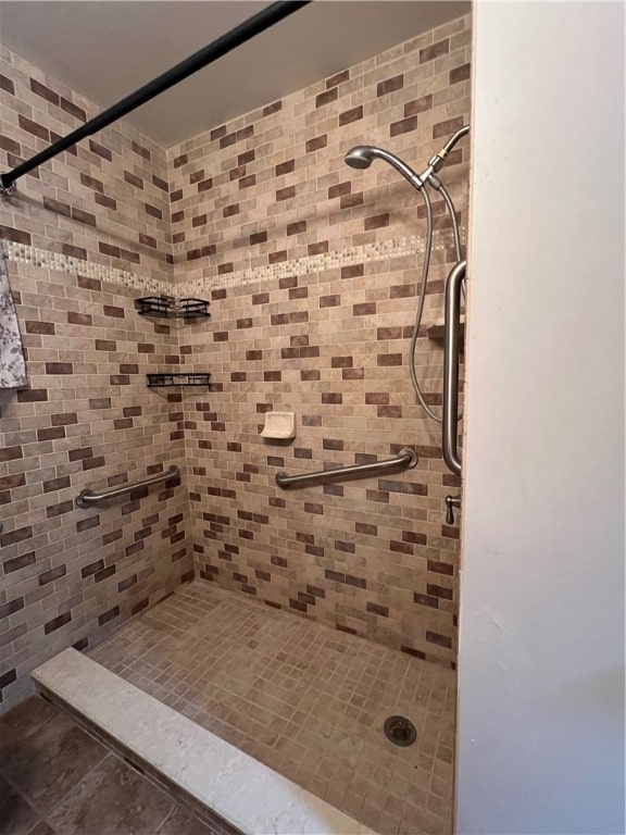 bathroom with tiled shower