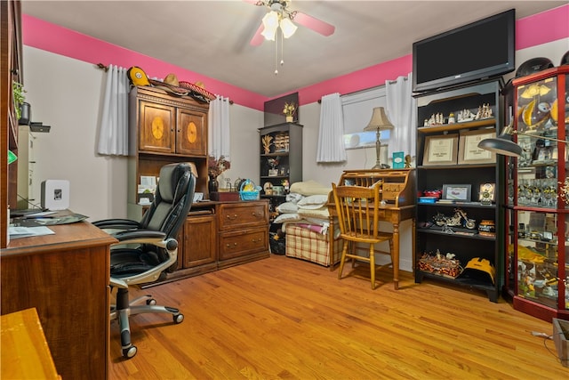 office featuring ceiling fan and light hardwood / wood-style flooring