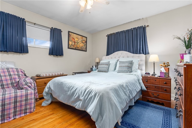 bedroom featuring hardwood / wood-style floors and ceiling fan