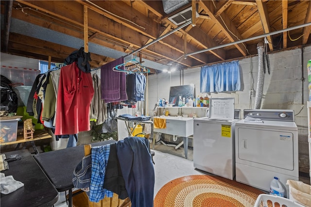 washroom featuring separate washer and dryer and sink