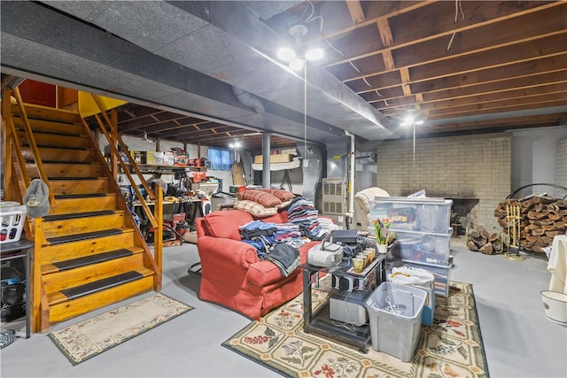 basement featuring brick wall